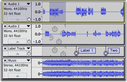 Two mono tracks (one containing a selection to be cut) above a label track that separates a stereo track below into a second Sync-Locked Track Group.